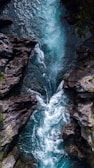 water falls on rocky mountain