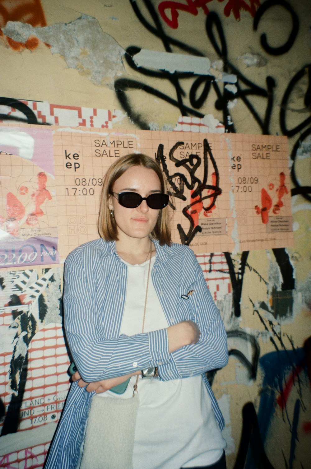 woman in black and white striped long sleeve shirt wearing black sunglasses