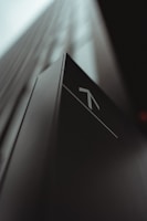 white and black arrow sign