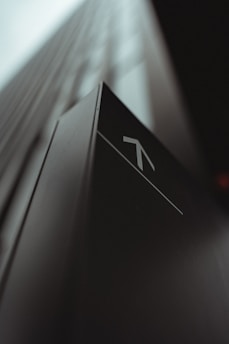 white and black arrow sign