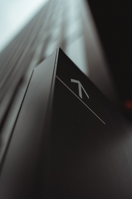 white and black arrow sign