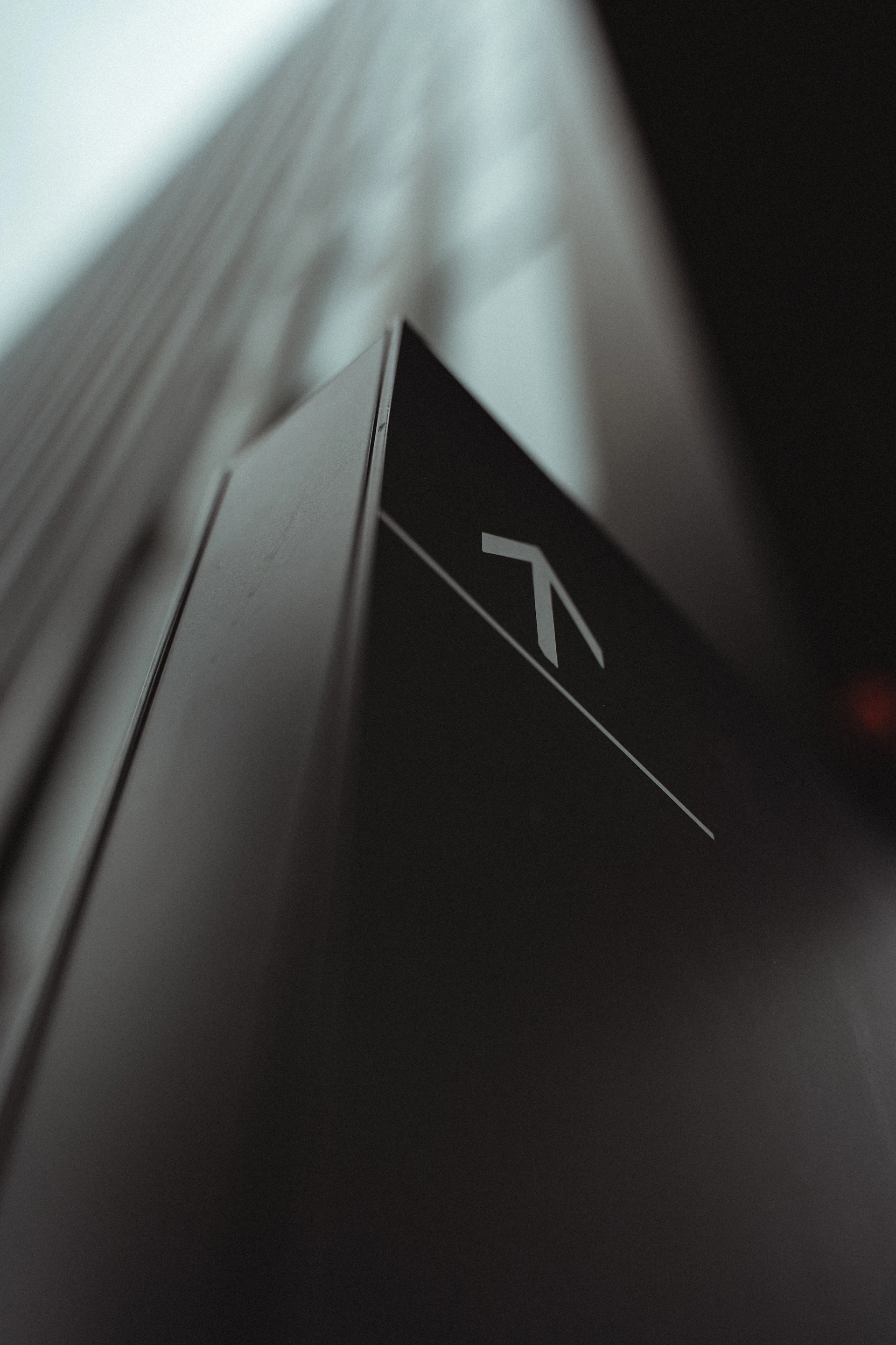 white and black arrow sign