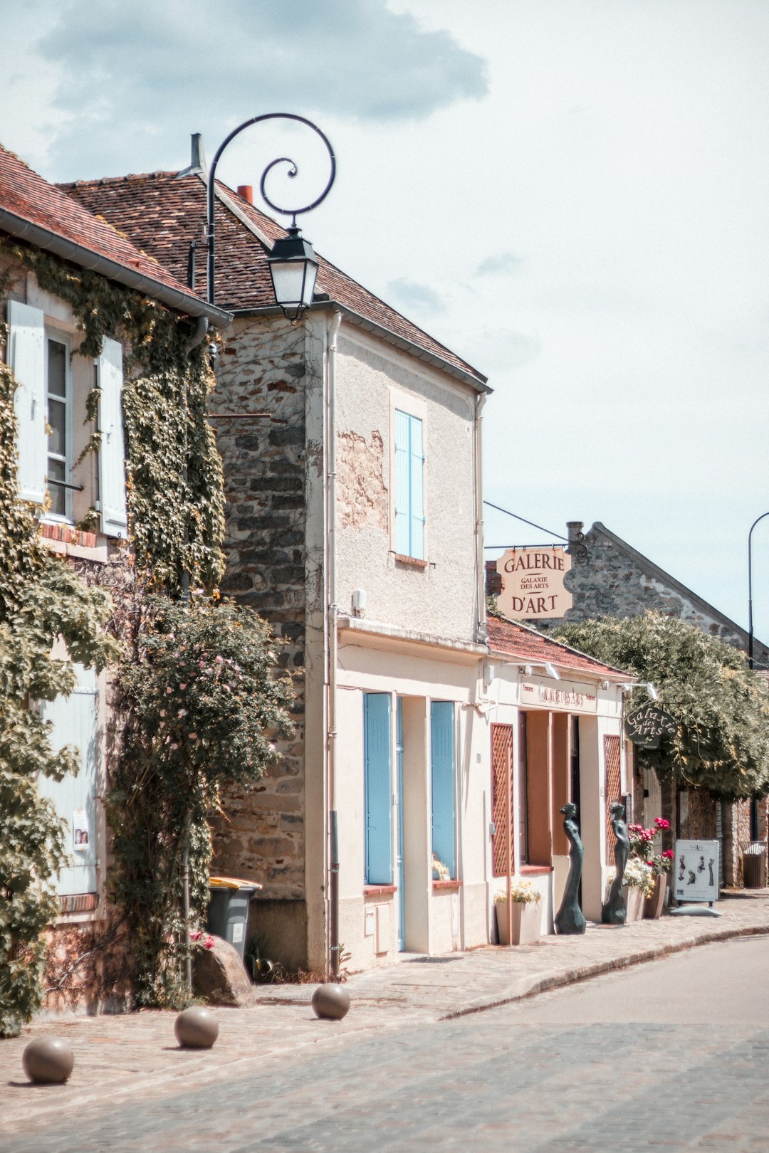 people walking on sidewalk near houses during daytime