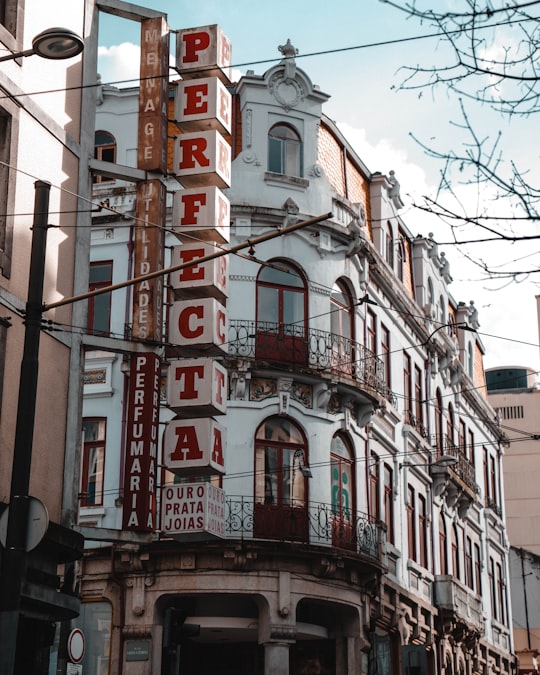 red and white concrete building in Oporto Portugal