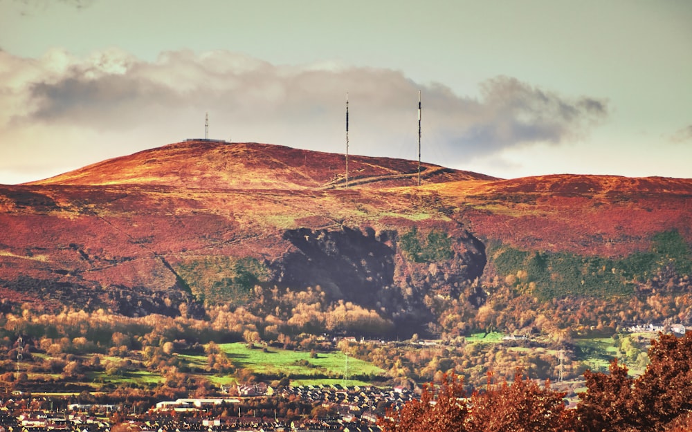 brown mountain under gray sky