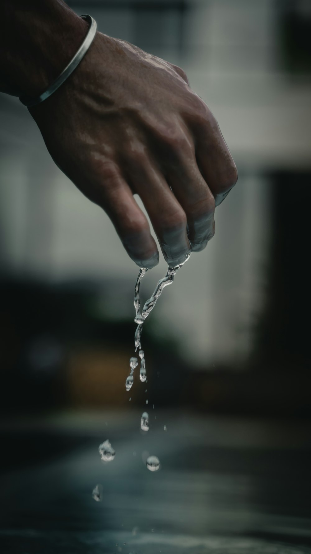person pouring water on water