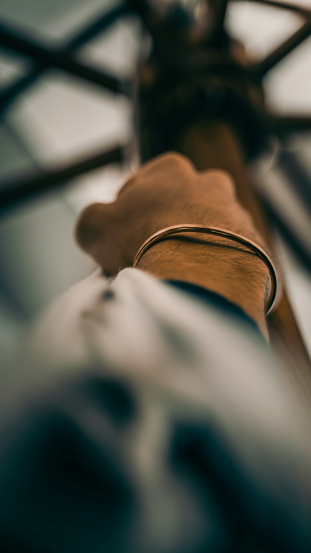 person wearing brown leather bracelet