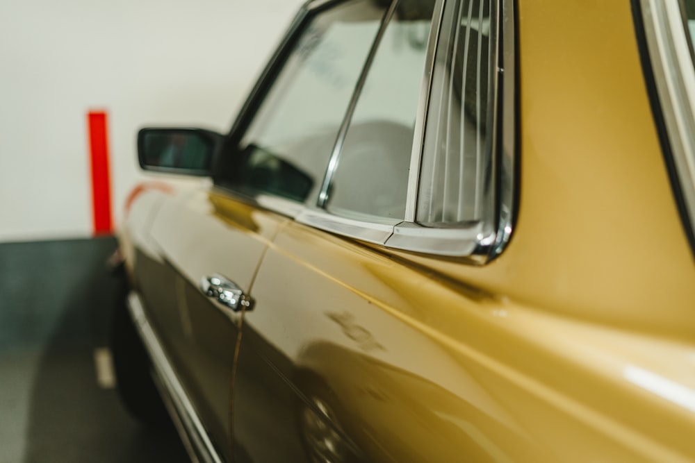 yellow car with white snow on top