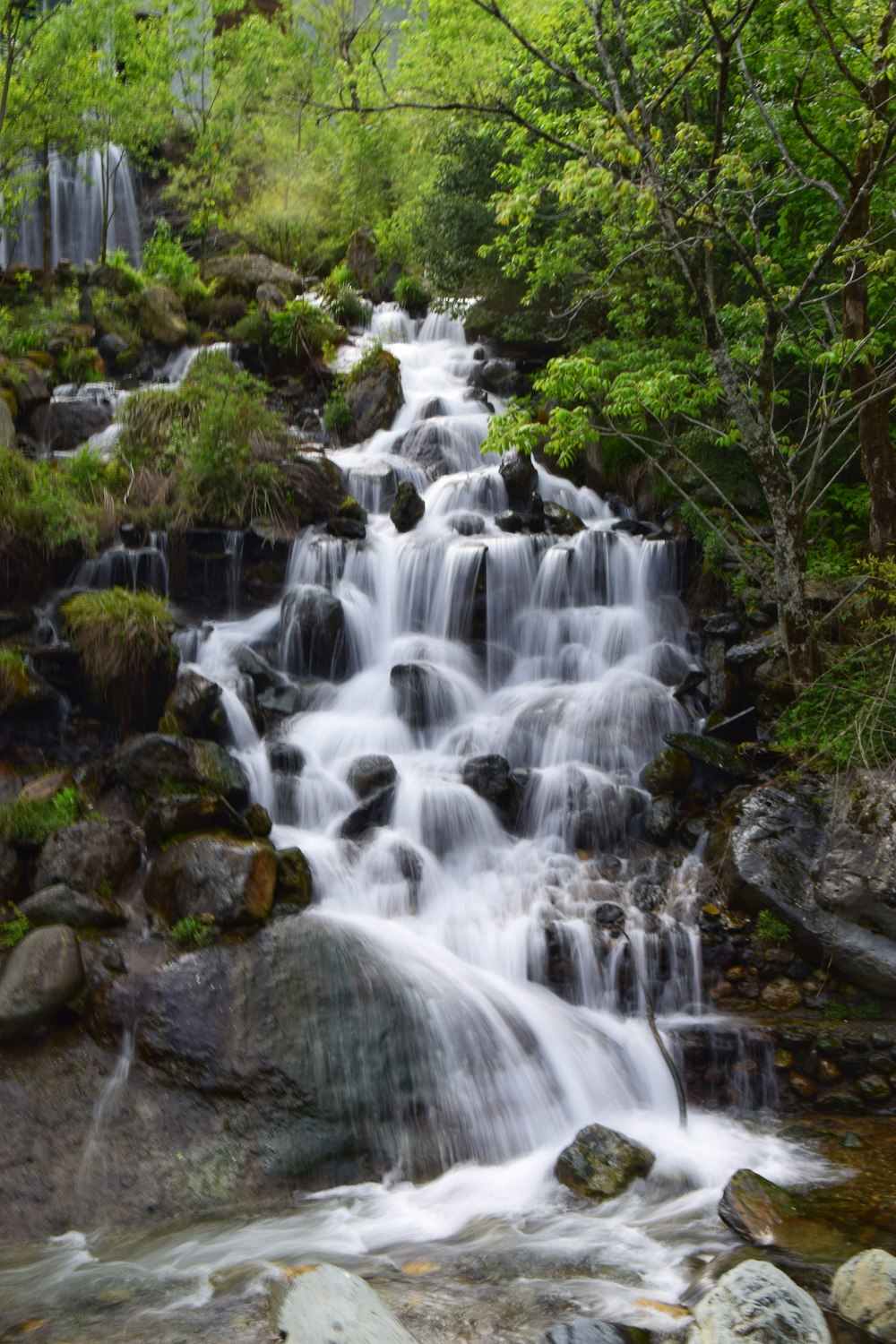 time lapse photography of water falls