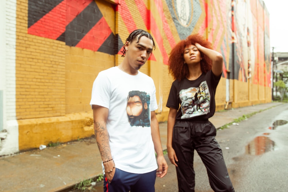 man in white crew neck t-shirt standing beside woman in white t-shirt