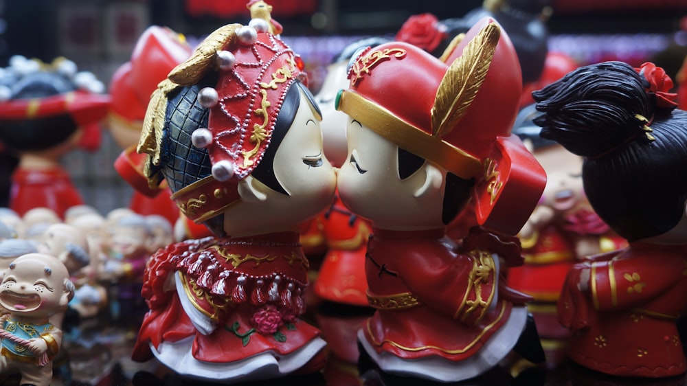 red and white ceramic figurine