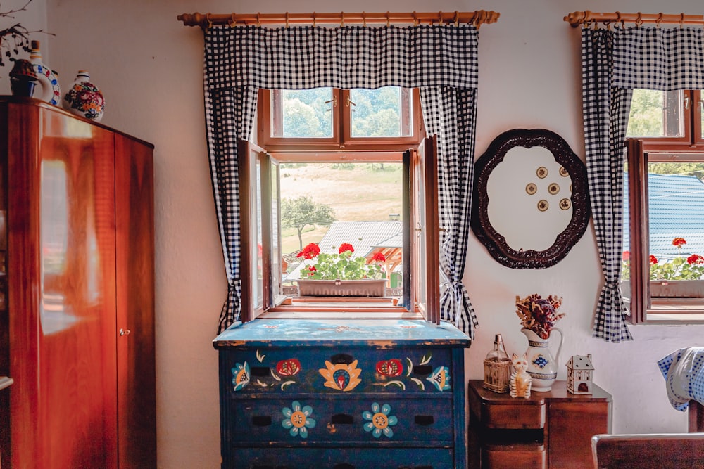 blue wooden dresser with mirror