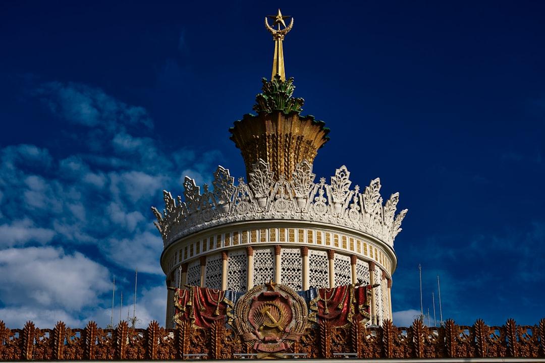 white and gold temple under blue sky