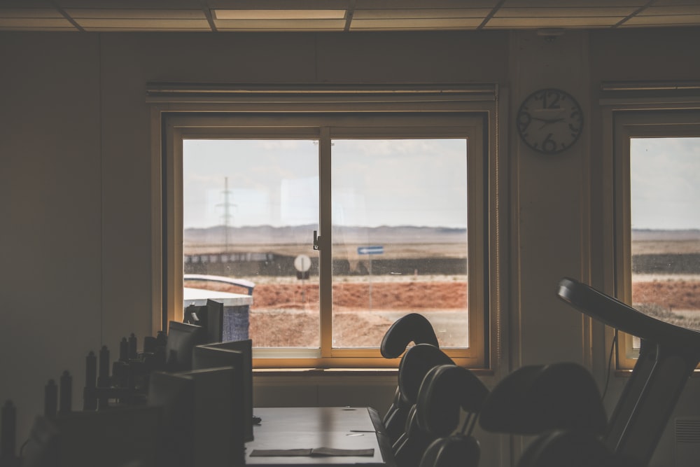 person sitting on chair near window