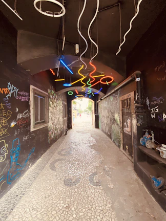 An easter egg hidden in a graffiti-covered alleyway, glowing subtly under streetlights.