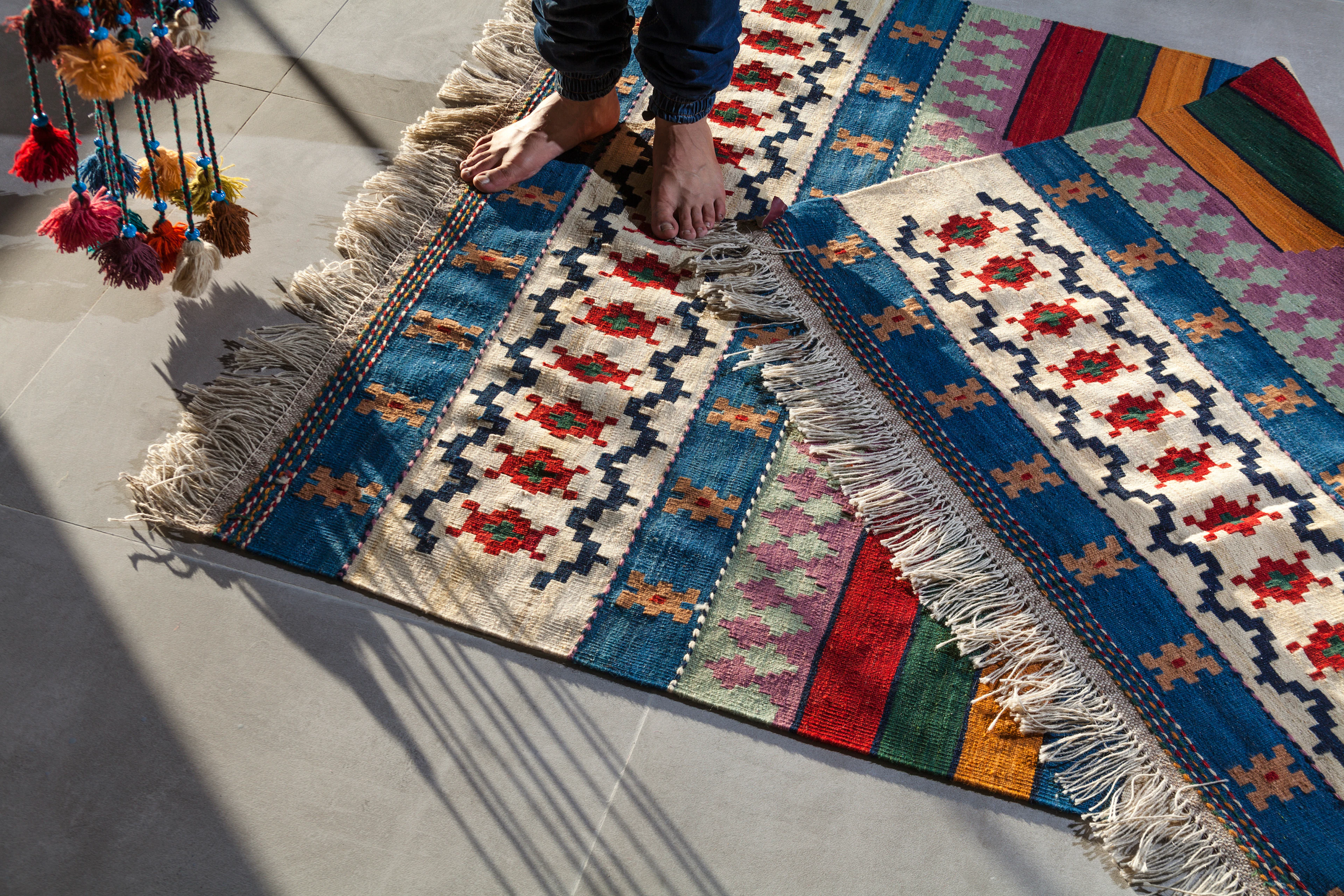 Kilim rug with fringe on a light floor