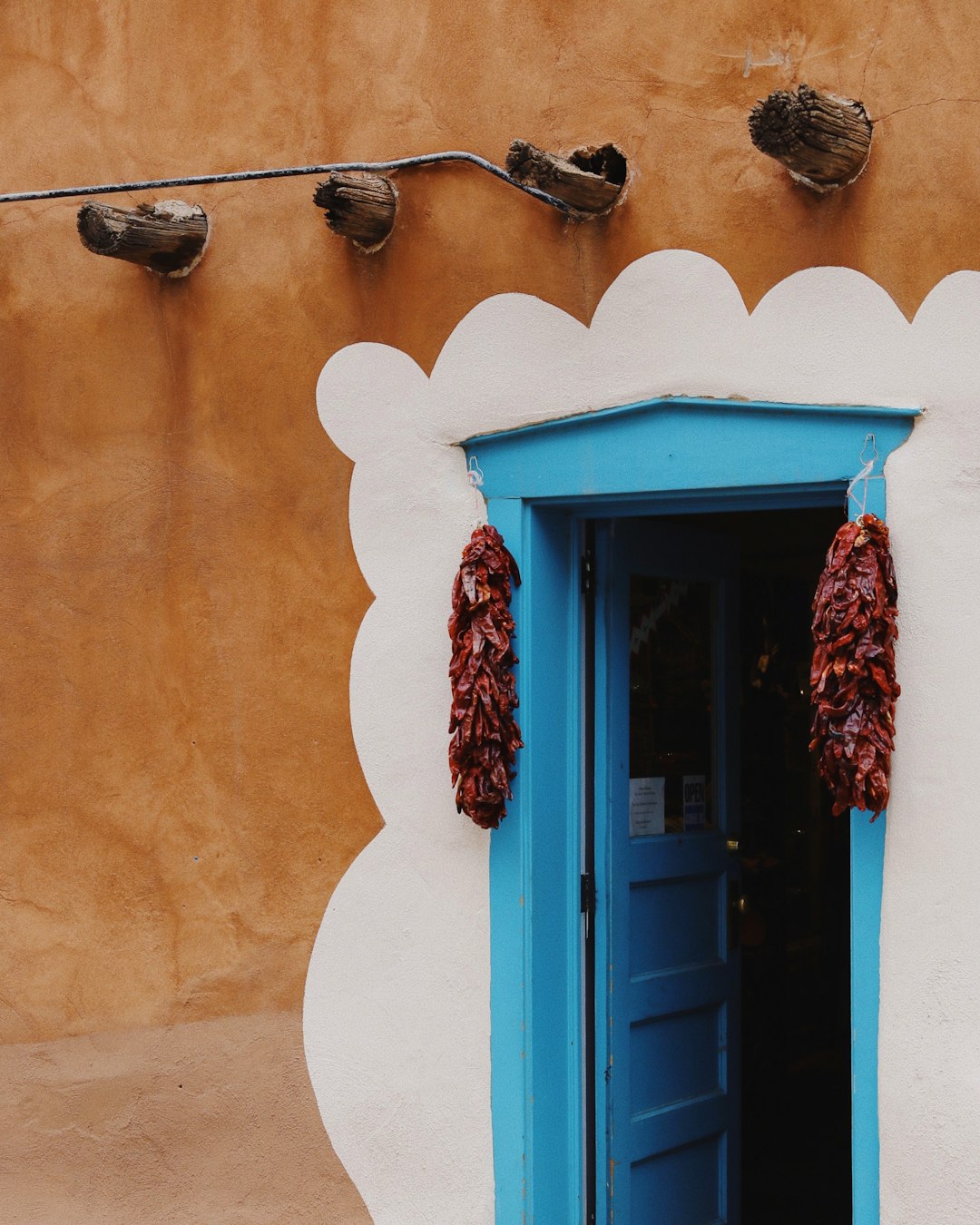 blue wooden door with red door frame