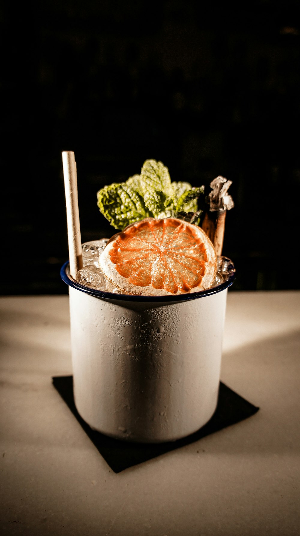 orange fruit in white bucket