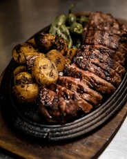 grilled meat on black ceramic plate