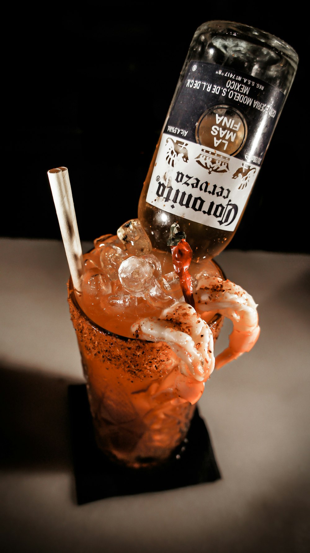 clear drinking glass with brown liquid