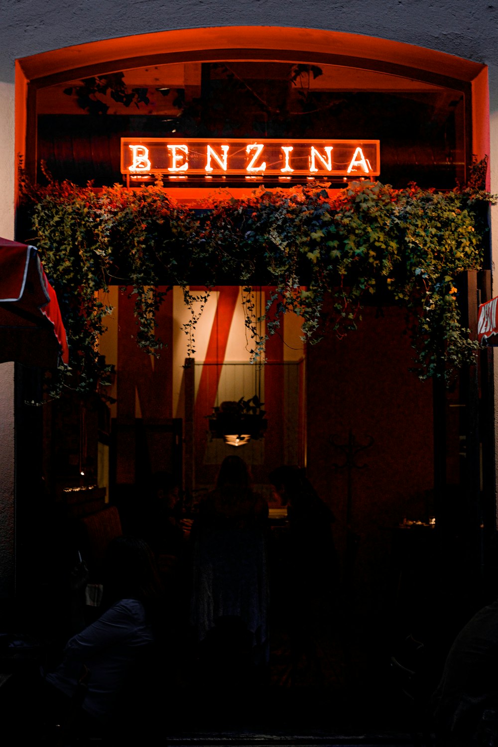 people standing in front of store during night time