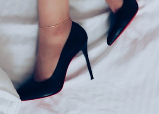 woman wearing black peep toe heeled shoes