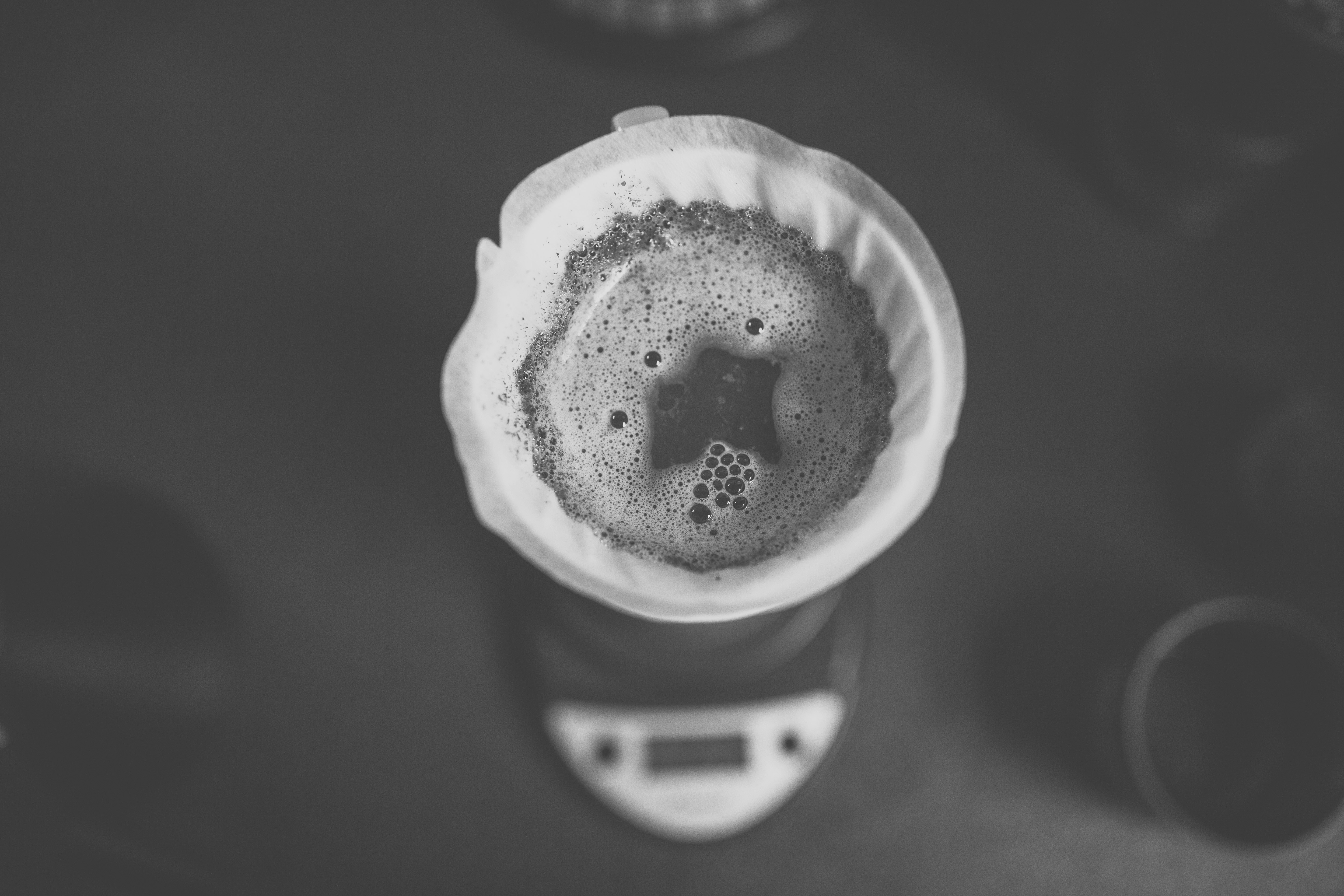 white ceramic cup with black liquid