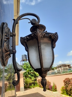 A beautiful solar LED wall lamp displayed outdoors, showcasing its design and functionality.