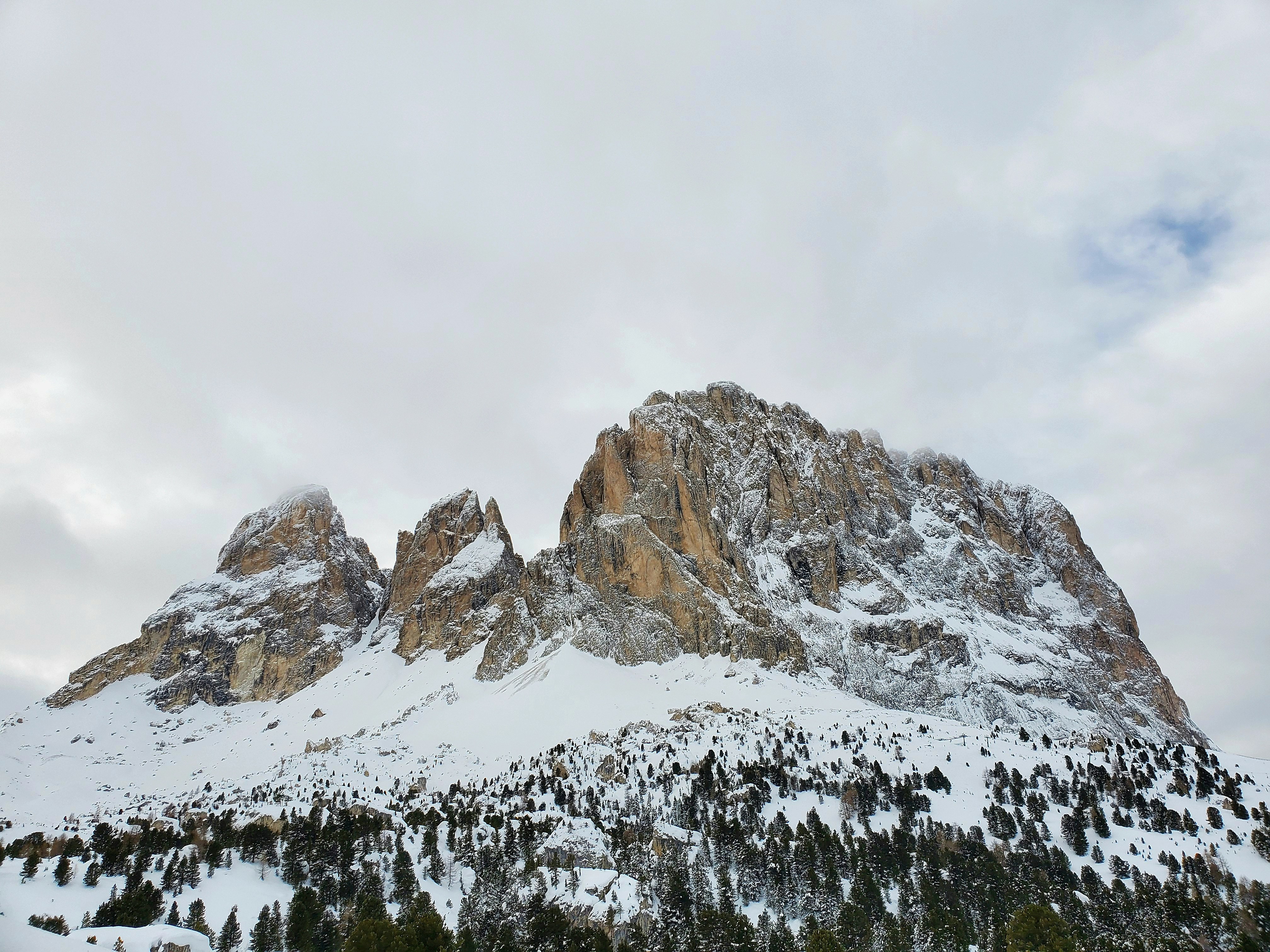 snow covered mountain during daytime
