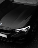 black bmw car in close up photography