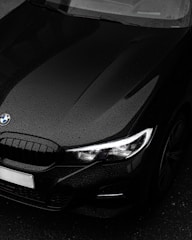 black bmw car in close up photography
