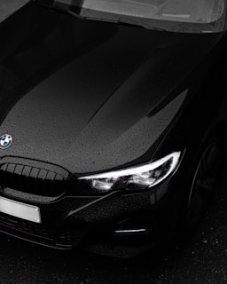 black bmw car in close up photography