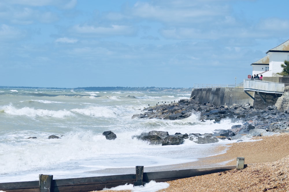 ocean waves crashing on shore during daytime