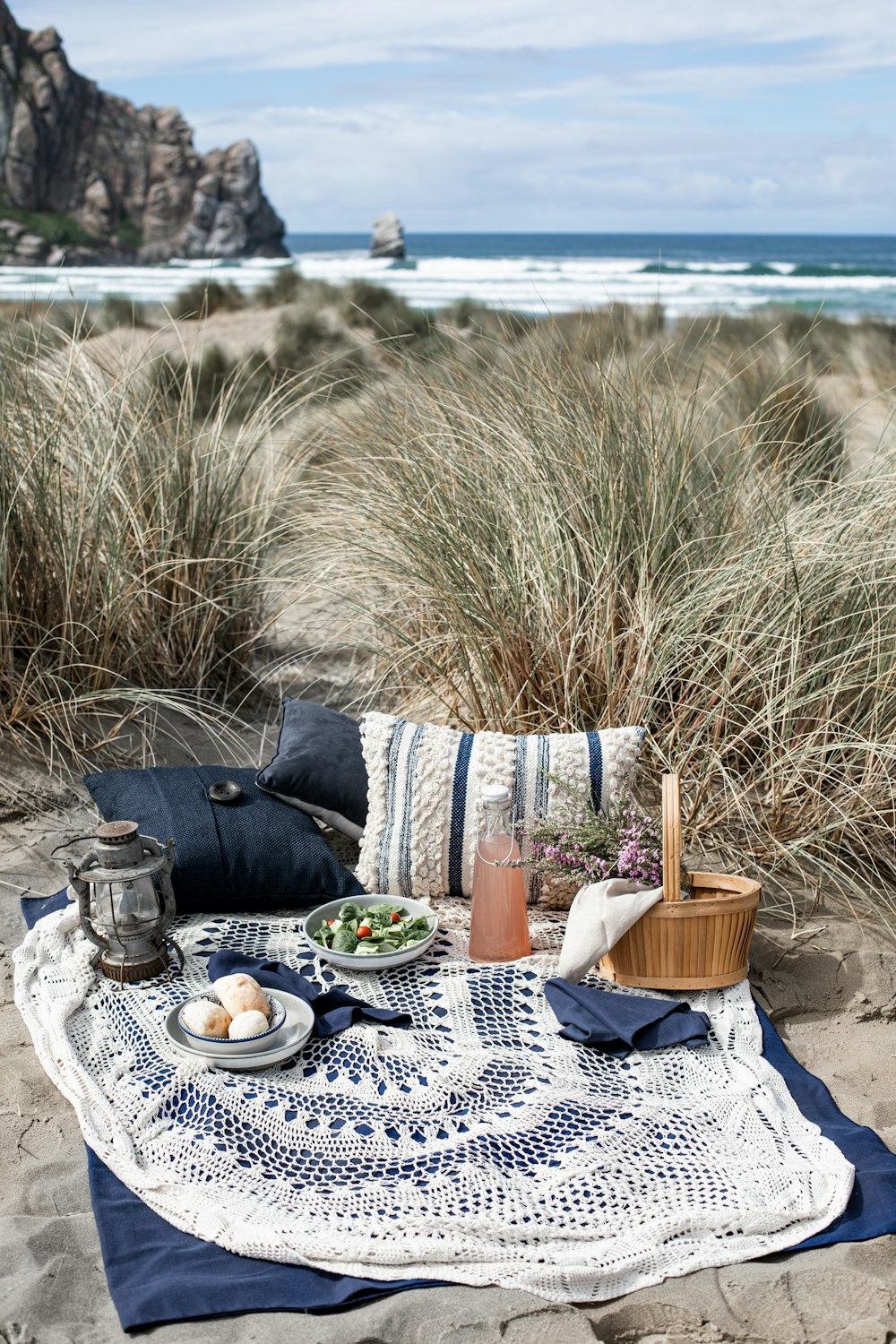 blue and white ceramic bowl on white table cloth