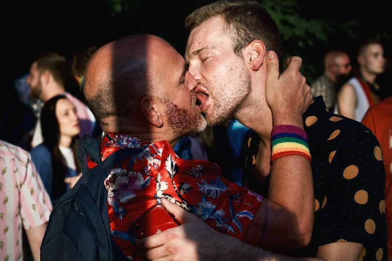 stylish gay man in colorful floral shirt