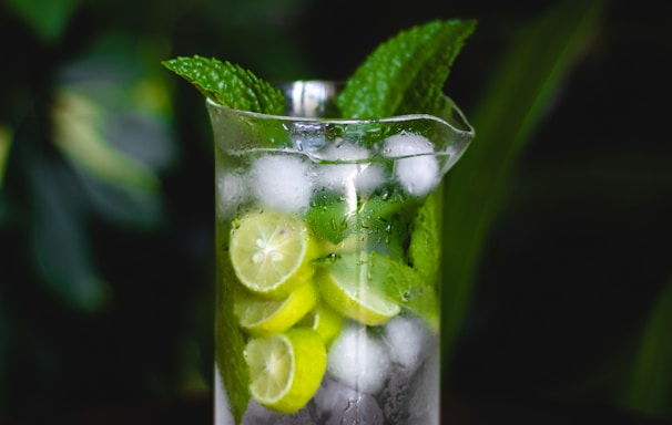 clear drinking glass with green fruit