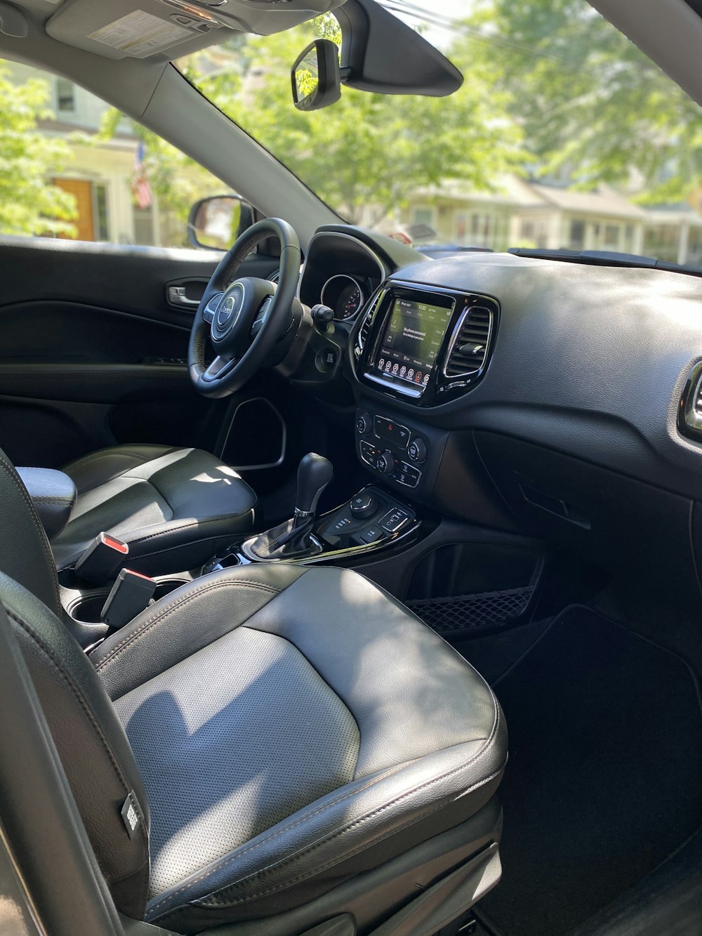 black car steering wheel and car seat