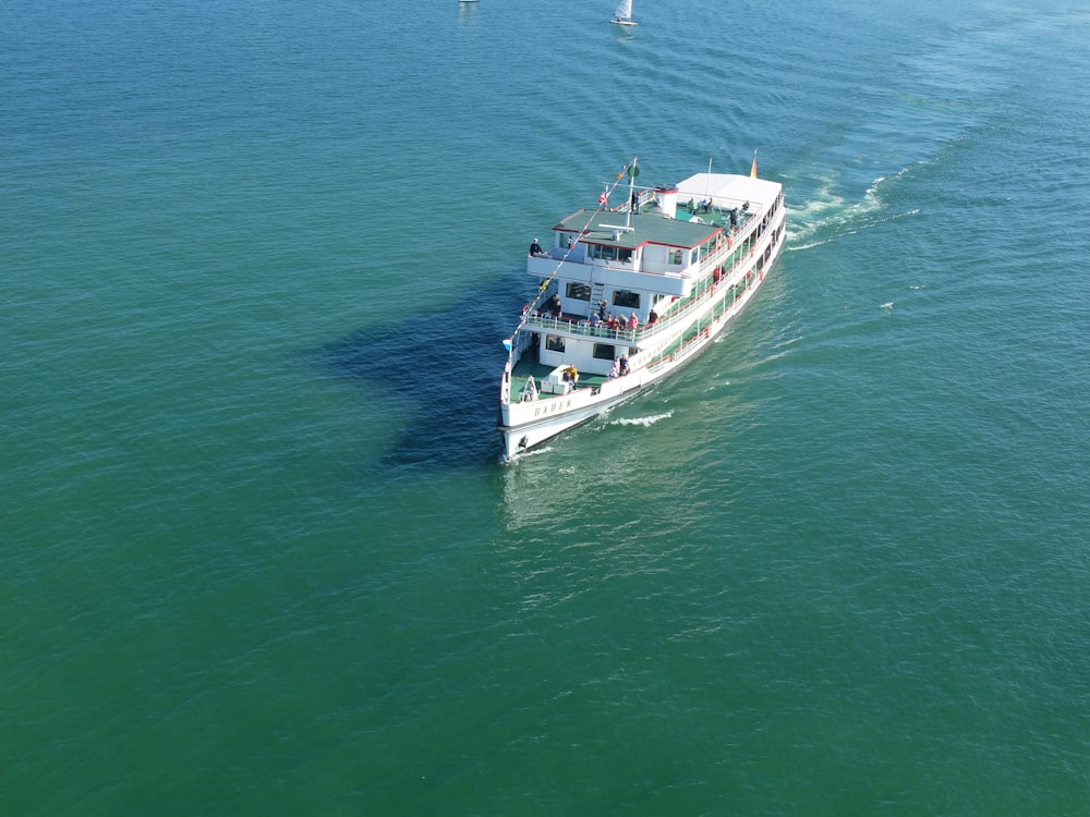 white and blue boat on sea during daytime