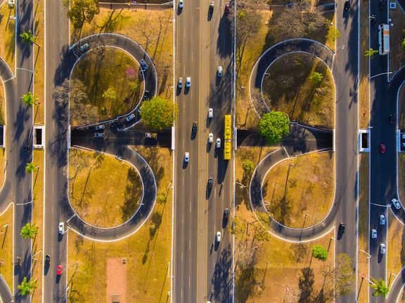 Dynamic aerial footage of vehicle movement showing organized entry and exit flow.
