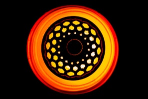 Illustration of Aries symbol with fiery red and orange hues representing March-April