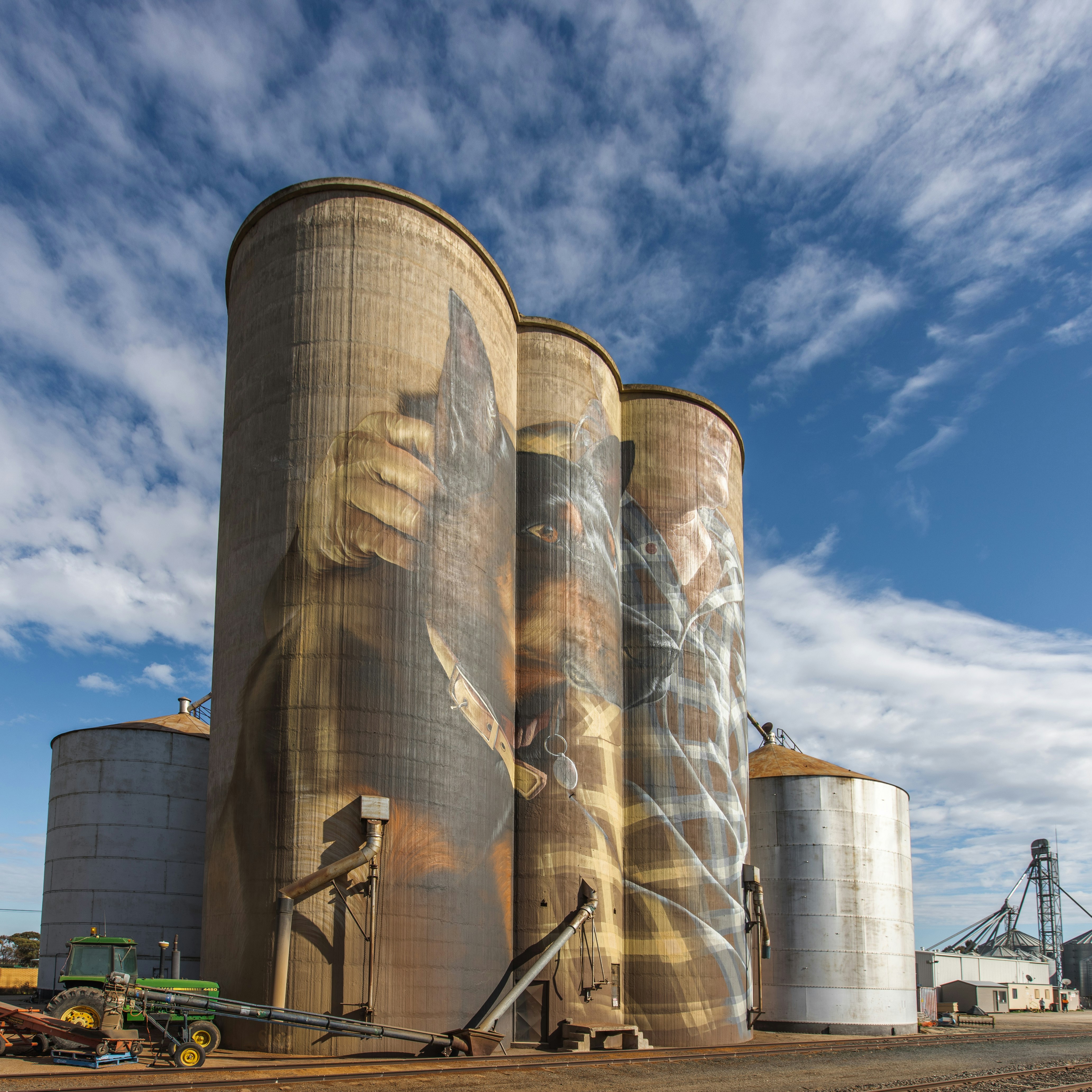 brown and blue factory under blue sky during daytime