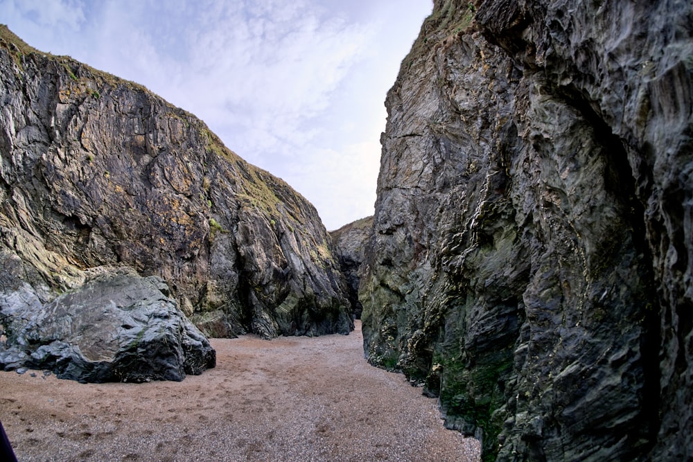 gray rock formation under white clouds during daytime