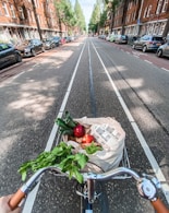 red roses in brown cardboard box on bicycle