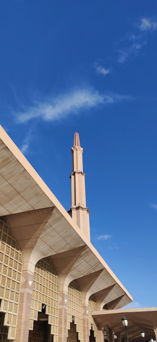 white concrete building under blue sky during daytime in Masjid Putra Malaysia