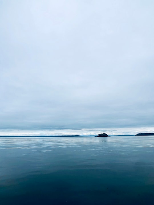 body of water under cloudy sky during daytime in Admiralty Inlet United States