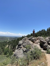 A traveler using a Podmart backpack in a scenic location.