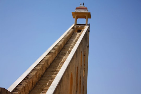 brown wooden bridge under blue sky during daytime in Rajasthan India