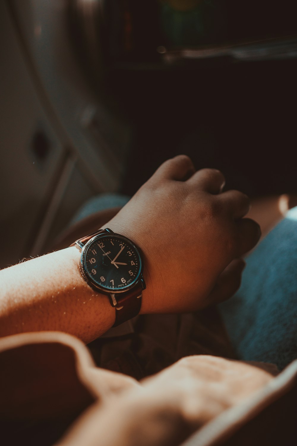 person wearing black analog watch
