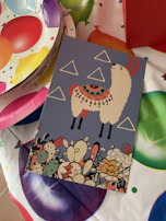 A colorful naming ceremony invitation featuring playful illustrations and bright accents.