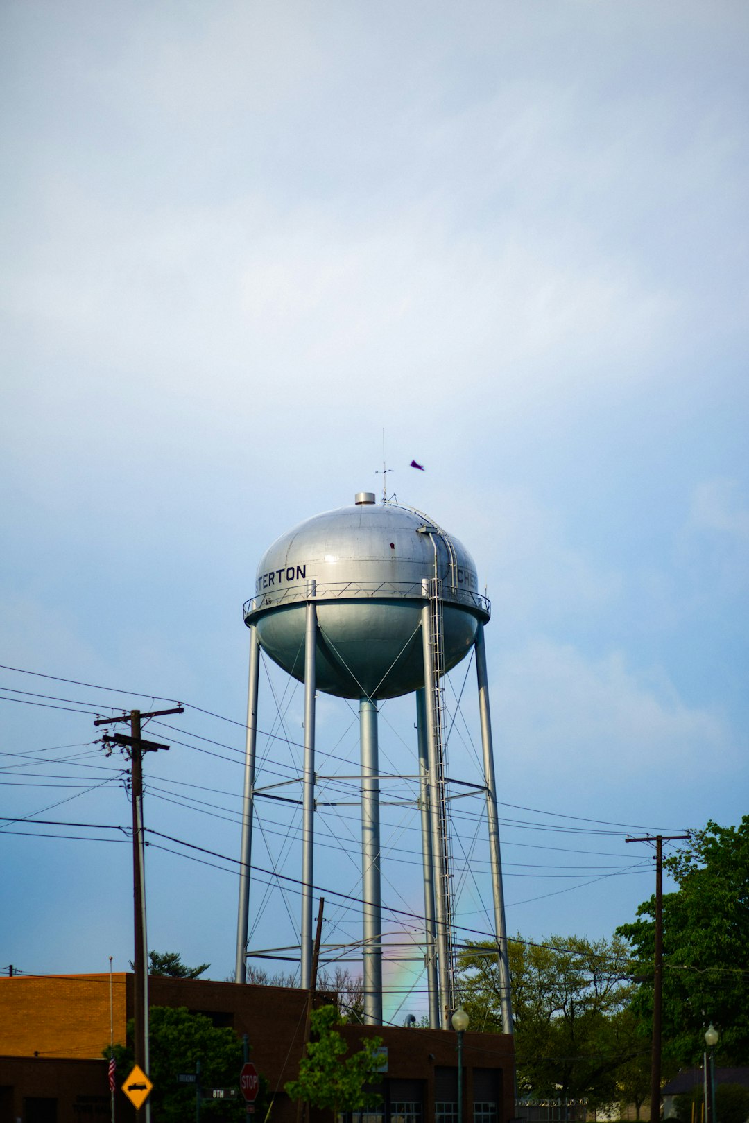 white water tank under white clouds